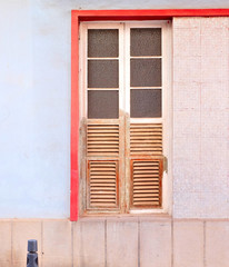 Old wooden frame window in a an old villa house, ready for reconstruction and refurbishment.