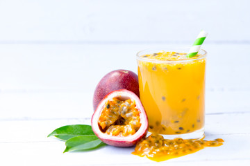 fresh passion fruit  juice smoothies isolated on white wooden background, Healthy drink concept, Selective focus, Copy space.