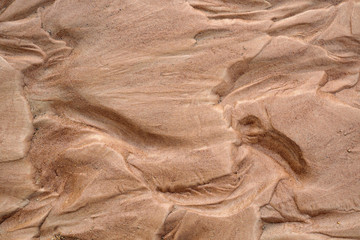 Wet brown sand nature texture background. top view