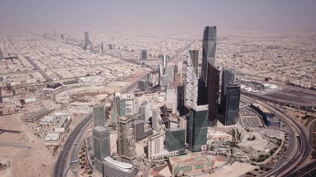 Tilting aerial view of modern business district (King Abdullah Financial district) in Riyadh, real estate economy investment Saudi Arabia