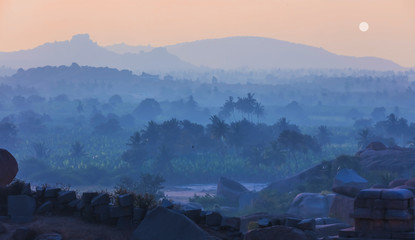 Sunset from hills of Hampi,India with mist