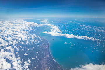 View from above on the earth, clouds and the sea. Aerial view of the coast of Malaysia