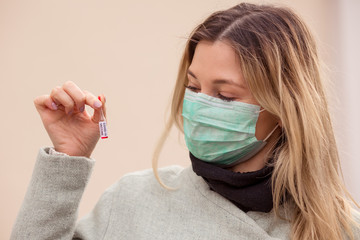 Doctor woman holding Corana virus Vaccine