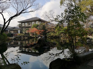 pond reflection of architecture in Osaka Castle Japanese Garden