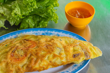 Vietnamese Banh Xeo crusty crepes stuffed with pork and shrimp