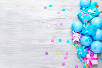 Many Birthday gifts and decor on wooden background