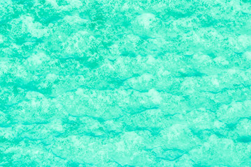 blue texture of an snow surface with pure ice white wave , blue cold clear cryslallized wall background ,decorative plaster background close up , abstract macro wallpaper