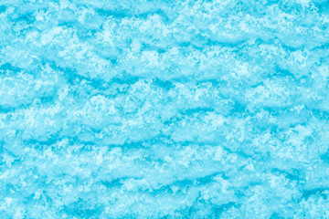 blue texture of an snow surface with pure ice white wave , blue cold clear cryslallized wall background ,decorative plaster background close up , abstract macro wallpaper