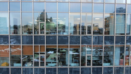 Street reflection on glass steel building facade
