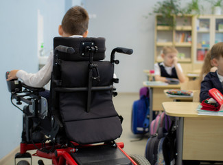A disabled student in a wheelchair in primary school.