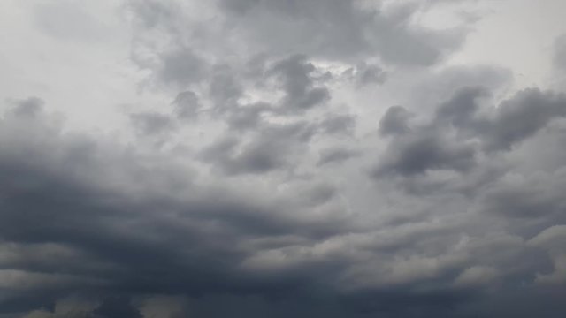 Mid afternoon thunderstorm rain clouds forming and blending across the african horizon  time lapse, noise free 4k footage.