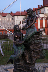 statue of mermaids