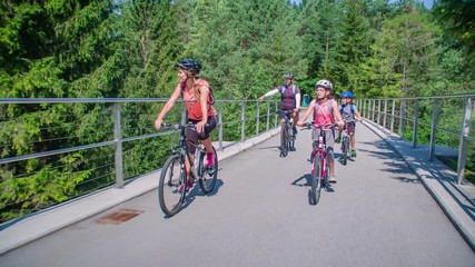 Happy active family have bicycle tour around Slovenia, tracking real-time