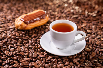 tea, custard cake, on background coffee beans