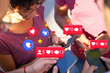 Group of people standing in circle and using cellphones with chat bubbles icons. Men and woman using smartphones for wireless connection. Group mobile solution concept