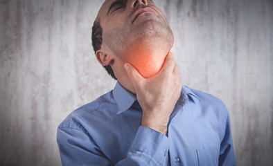 Fototapeta premium Caucasian man having throat pain.