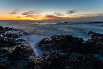 Obraz premium Beautiful sunset over the rocky coast of Fuerteventura