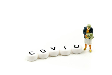 Miniature people : coronavirus covid 19 infected patient caution outbreak alert.