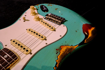close up detail of electric guitar Body heavy Relic with selective focus.