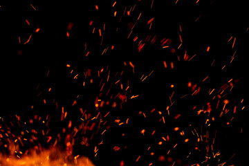 flame of fire with sparks on a black background