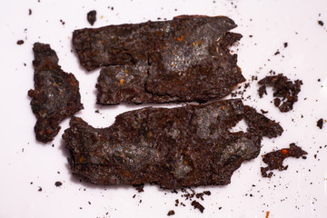 Pieces of Rusty metal texture on white acrylic, Abstract background, Close up shot, Selective focus, Industry concept