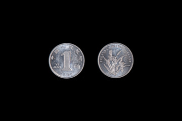 1 Jiao coin China 2000 on a black background. close-up on two sides. on the reverse is a blooming...