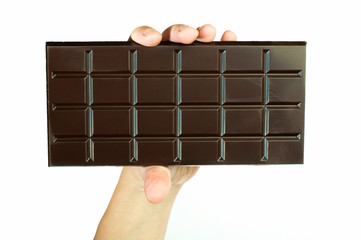 Hand holding chocolate bar