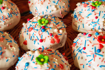 Easter cakes in a wicker basket. Homemade easter baking. Closeup, selective focus