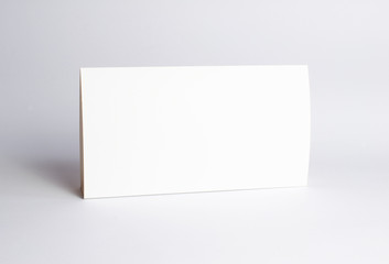Blank paper Table Tent table-tent on white as template for designers design presentation, showcase etc.