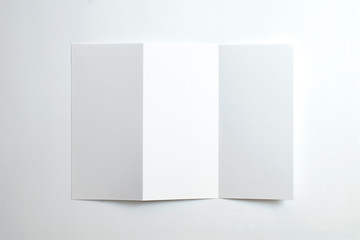 Blank opened tri fold brochure isolated on white as template for design presentation, showcase, etc.