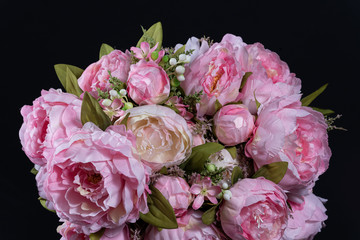 Beautiful bouquet of pink peonies . Floral composition on black background.