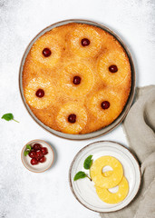 Delicious pineapple upside down cake with candied cherries. Homemade summer tropical dessert. Flat lay. 
