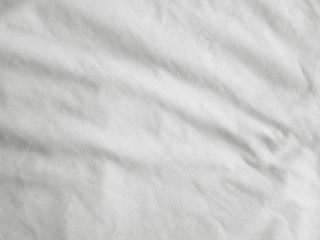 Soft white wrinkled fabric background