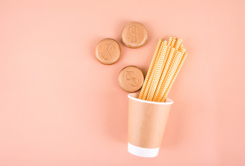Paper glass with drinking tubes. Eco utensils on a light background. Zero waste.