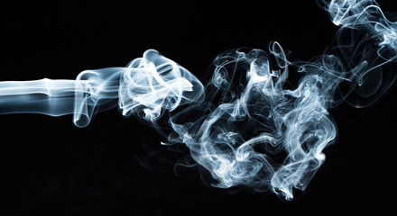 Photo of a wisp of smoke on a dark background
