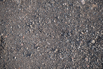 Background image of the surface of a gravel walking path