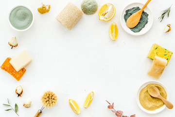 Frame with set of homemade cosmetics ingredients with cosmetic clay. Spa treatments, aroma theme. White deck, top view