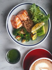 Lunch at cafe, Bowl with salmon and a sweet drink, Top view, Blo