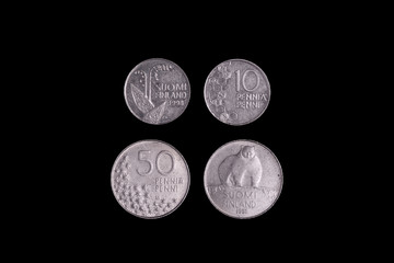 Old Finnish Coin Isolated on black background, close-up on two sides.