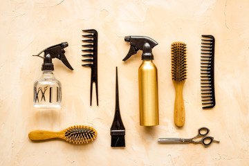 Hairdresser tools pattern on beige background top-down