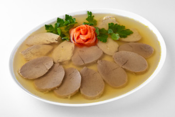 Jellied of different types of meat, beef, pork and poultry. Jelly from broth and vegetables. Banquet festive dishes. Gourmet restaurant menu. White background.