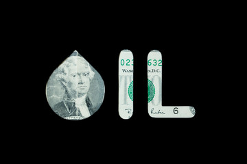 Petroleum. Black oil sign on a two dollar bill black background concept.