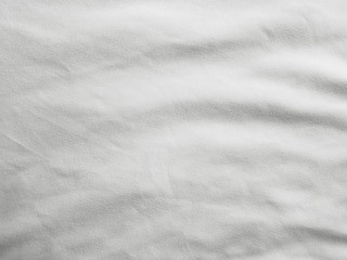 Naklejka premium Soft white wrinkled fabric background
