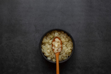 chinese dessert tong sui(Sweet Soup)ingredients ;Chinese cuisine, dried saponin rice on dark gray background, health food,a traditional food.