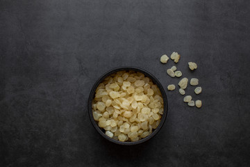 chinese dessert tong sui(Sweet Soup)ingredients ;Chinese cuisine, dried saponin rice on dark gray...