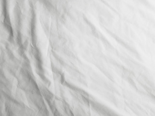 Fototapeta na wymiar Soft white wrinkled fabric background