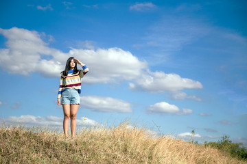 portrait asian girl relaxation on hill with sky