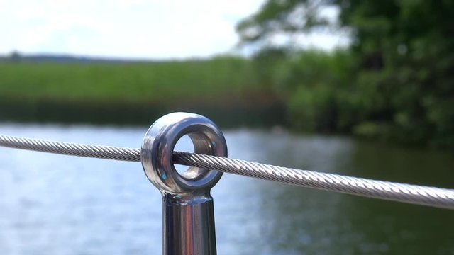 boat fence in close upp when traveling on a beautiful waterway in Sweden