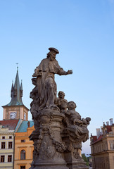 Obraz premium Sculpture of Saint Ivo in Prague - patron of beggars and poor people in city. Photo of colorful European city of Prague in Czech Republic daytime, month of may 2019, travel in tourist place.