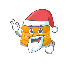 Orange macaron in Santa cartoon character design showing ok finger